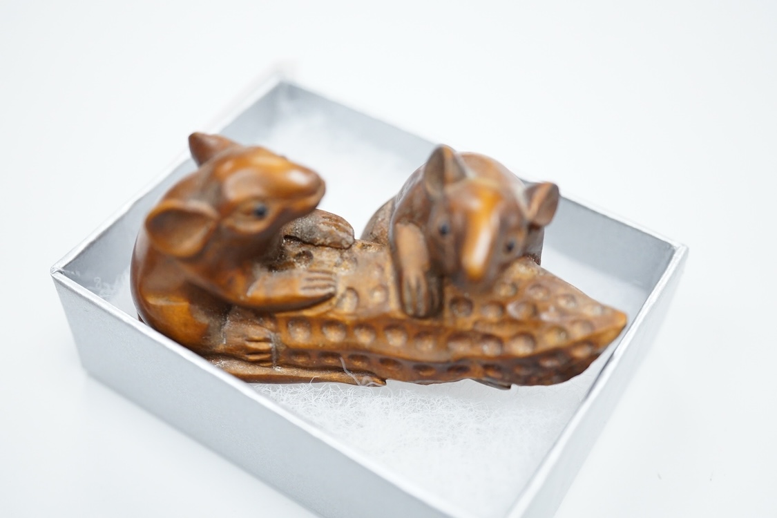 Three carved hardwood netsuke, signed